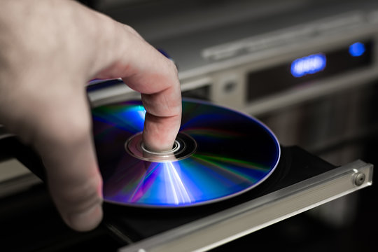 DVD disc inserting to player