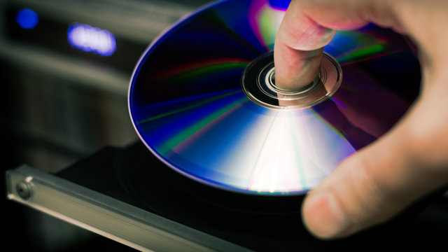 DVD disc inserting to player