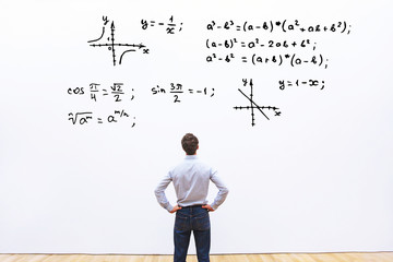 student looking at mathematical formulas, learn maths education concept © Song_about_summer