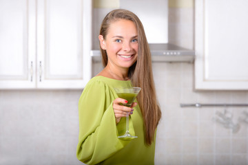 Naklejka na ściany i meble Smiling girl with organic matcha green tea