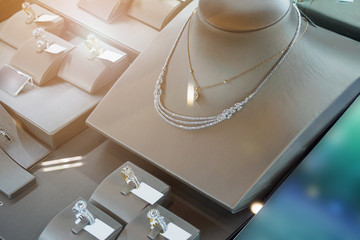 jewelry diamond shop with rings and necklaces luxury retail store window display