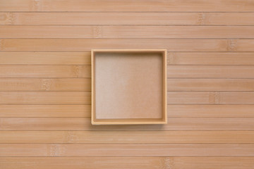 Square box on bamboo, top view