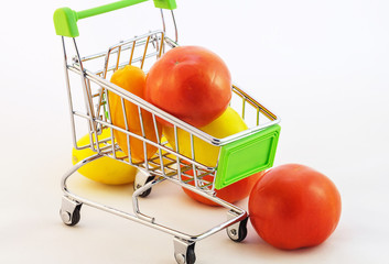 children's toy cart for purchases which are tomatoes