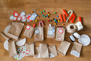 preparing the advent calendar. bags and sweets on the table