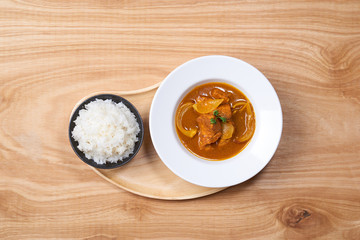 Chicken curry in a bowl / Vietnam chicken curry on wooden background