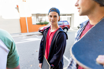 Teenager walking down the street in summer day