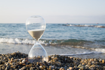 Hourglass on the beach, on the Mediterranean coast
