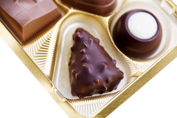 A collection of mixed chocolates against a white background