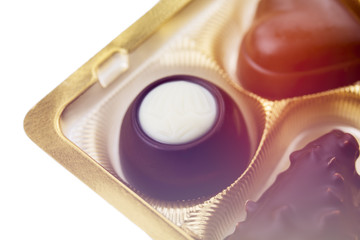 A collection of mixed chocolates against a white background