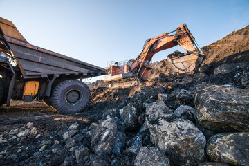 type of coal quarry with working machinery
