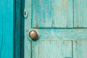 Fototapeta premium Old blue wooden door with brass handle Round