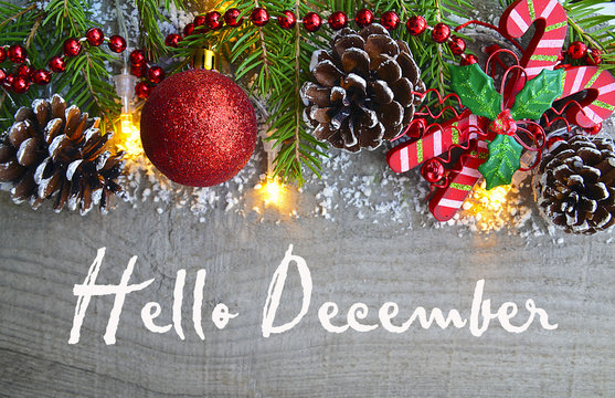 Hello December.Christmas decoration on old wooden background.Winter holidays concept.Selective focus.