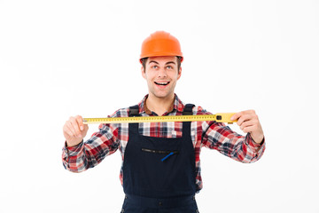 Portrait of a happy young male builder
