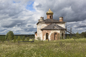 Rural landscape with the restored church of St. Nicholas the Wonderworker in the village of Sredny (Olyushino), Verkhovazhsky district, Vologda region, Russia