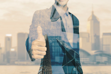 Happy business man holding his thumbs up isolated over white background
