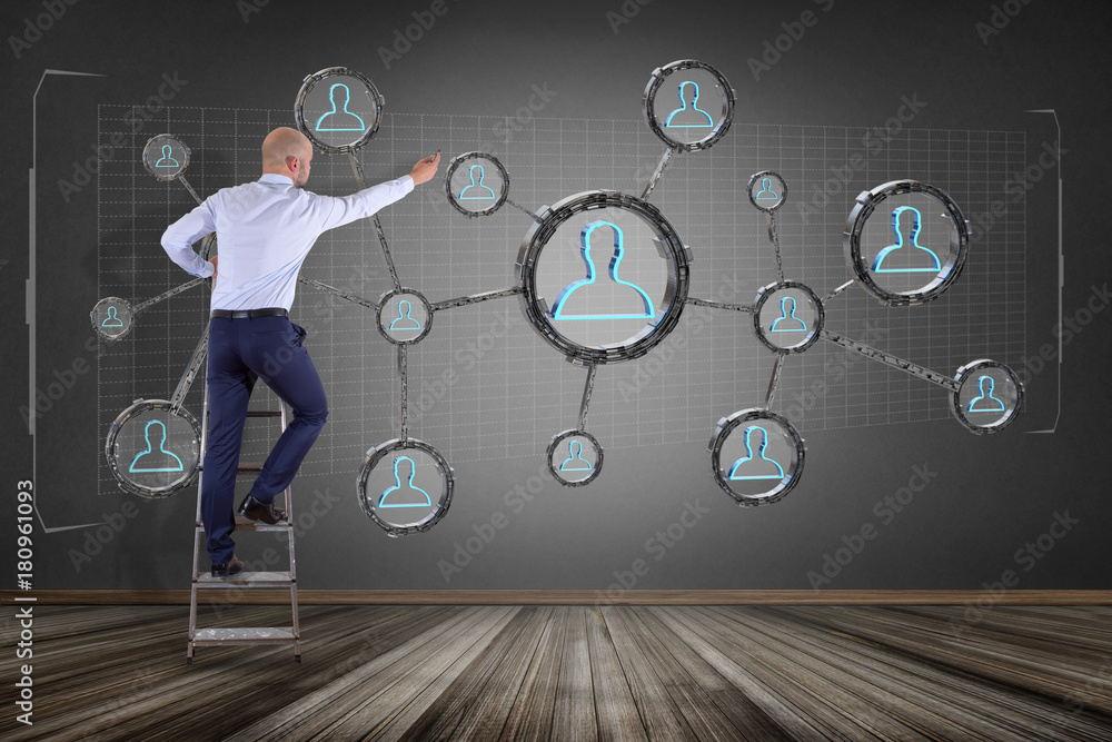 Poster businessman in front of a wall with network connection with people linked each other in technology w