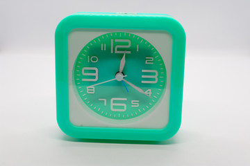 Desk clock, alarm clock, beautiful color on a white background.