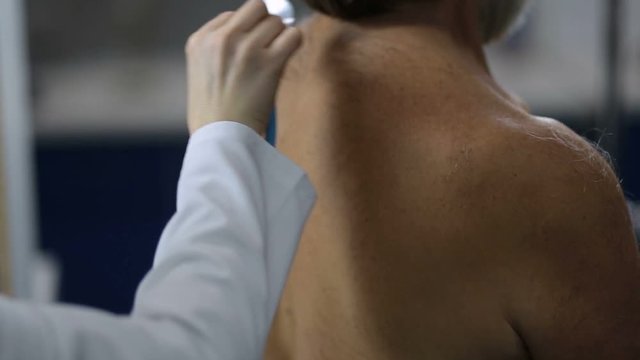Lungs auscultation with stethoscope at clinic