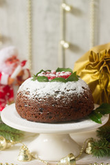 Christmas cake or pudding in festive decoration.