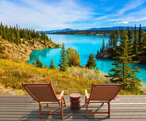 Two comfortable wooden deckchairs