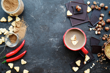 Heart Cookies in mug with milk chili chocolate . Top view, dark background