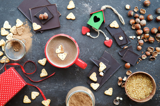  Valentine's Day concept photo. Heart Cookies in mug with milk chocolate. Top view
