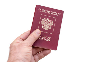 Russian passport in the man's hand  on a white background. Isolated