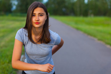 Teen girl runner in the park