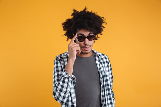 Portrait of a young afro american man posing in sunglasses