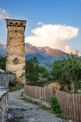 Old stone svan tower in street of Mestia town in Svaneti, Georgia