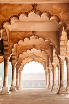 Row of columns and arches in Agra, India. Old beautiful Indian architecture