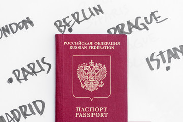 Russian passport against the background of the names of European capitals