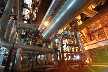 Equipment, cables and piping as found inside of a modern industrial power plant