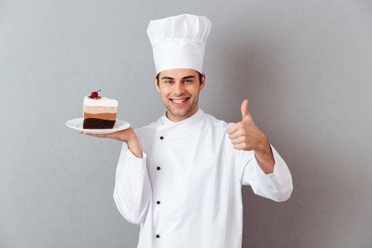 Portrait of a cheerful male chef dressed in uniform
