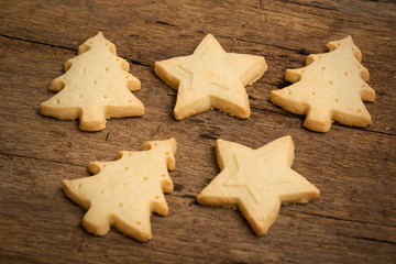Fototapeta na wymiar Christmas cookie on wooden background