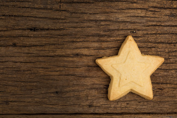 Fototapeta na wymiar Christmas cookie on wooden background
