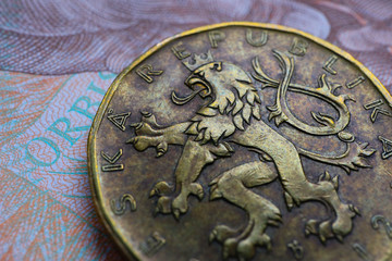 Czech republic currency koruna, banknote pattern background, close up. Photo depicts Czech cash shiny korun czk metal coins, close up, macro view.