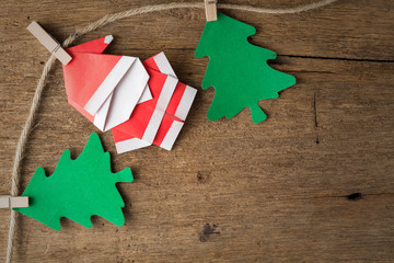 Santa claus paper craft on wooden background