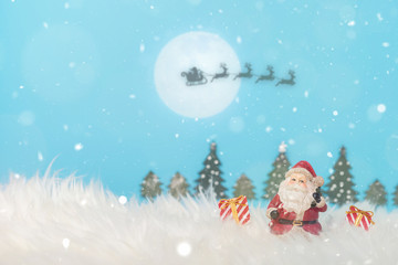 Christmas holiday background with Santa and decorations. Christmas landscape with gifts and snow. 