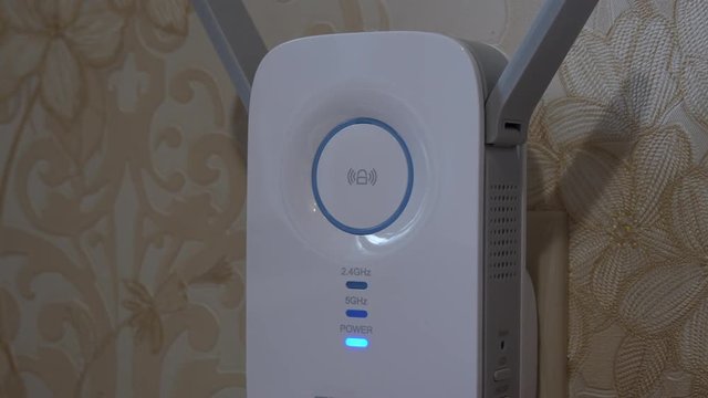 Female Finger Presses The Button On The Wireless Access Point