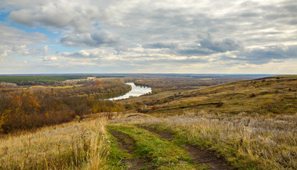 Fototapeta na wymiar Panoramic view of the Don river valley. Autumn landscape. Country road.