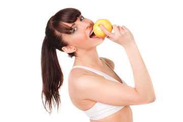 beautiful young woman with slim body in underwear eating an apple isolated