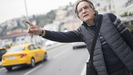 Senior man calls a taxi