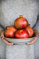 raw food concept - red ripe pomegranate fruit