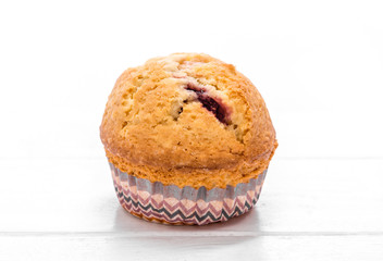 homemade muffins on a white wooden background