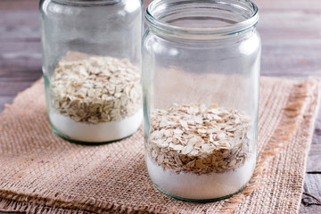 Oat flakes in a jar. Mixing of ingredients for cookies in a jar