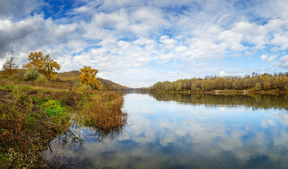 Autumn landscape in central Russia. View of the Dons River by the reflection of the cloudy sky.