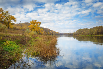 Autumn landscape in central Russia. View of the Dons River by the reflection of the cloudy sky.