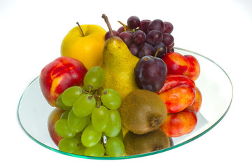 Fototapeta na wymiar The abundance of fruit on a tray of glass