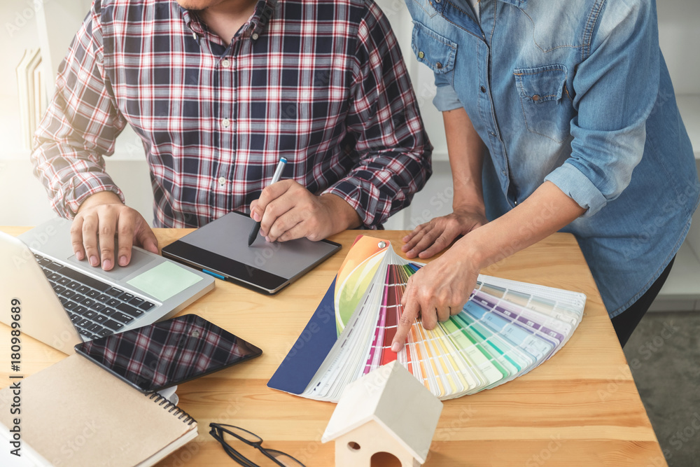 Poster young colleagues designers working together on a creative project and color samples for selection, c
